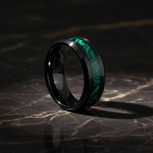 MALACHIP — Luxury 3/4 angle on dark marble — men's tungsten wedding ring.