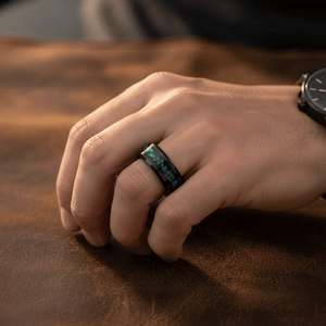 MALACHIP — Lifestyle photo on hand — men's tungsten wedding ring.