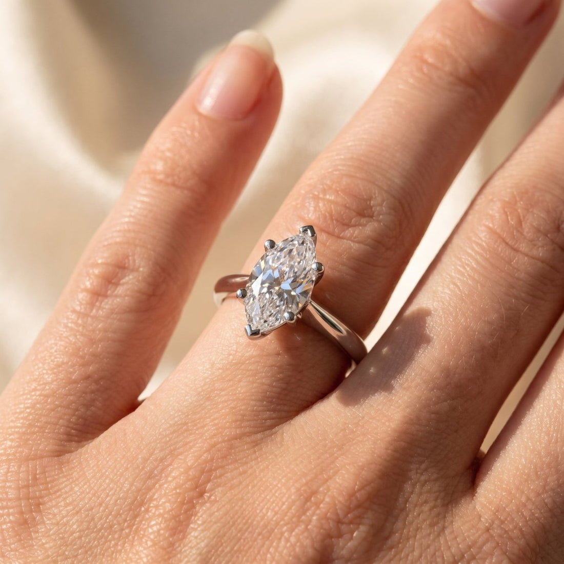 Marquise lab-grown diamond solitaire engagement ring, White Gold, on-finger close-up