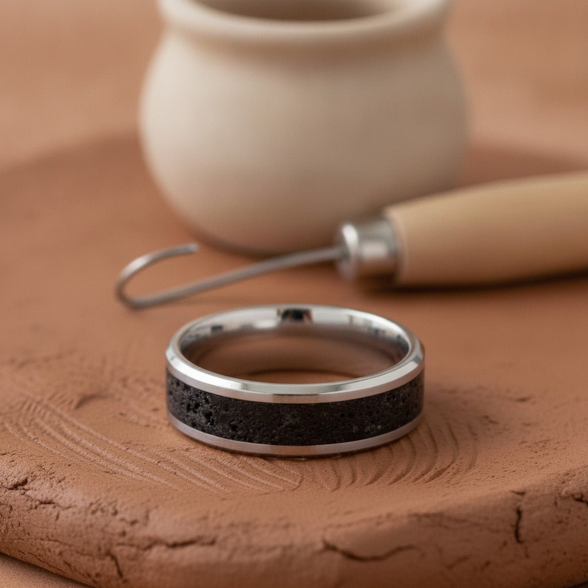 Aydins MAUNA | Titanium Ring Black And Gray Lava Inlay lifestyle scene, ceramic kiln