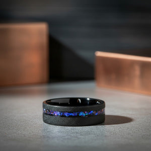 MIRAGE | Black Tungsten Ring, Alexandrite and Goldstone Inlay, Flat lifestyle photography