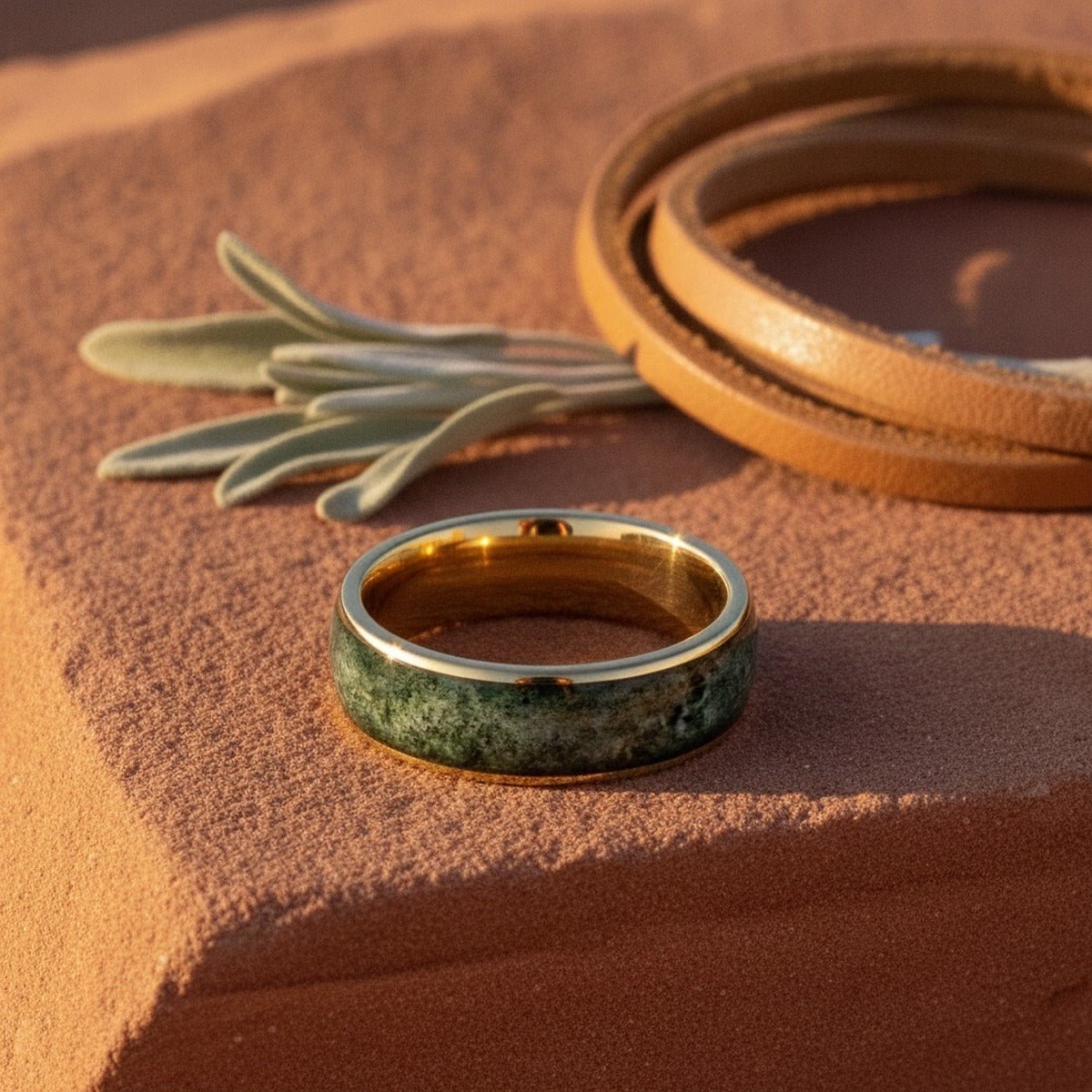 Aydins MOOSAIRE | Gold Tungsten Moss Agate Wedding Ring 8mm lifestyle scene, red canyon rock