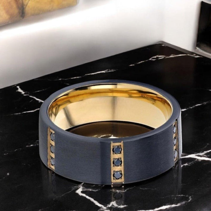 Elegant men's black titanium ring with gold inlay and 0.27 TCW black diamond setting.