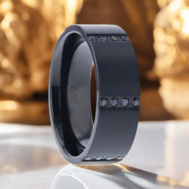 Flat brushed black titanium ring with quadruple black sapphires in horizontal channels, 8mm width - Aydins Jewelry.