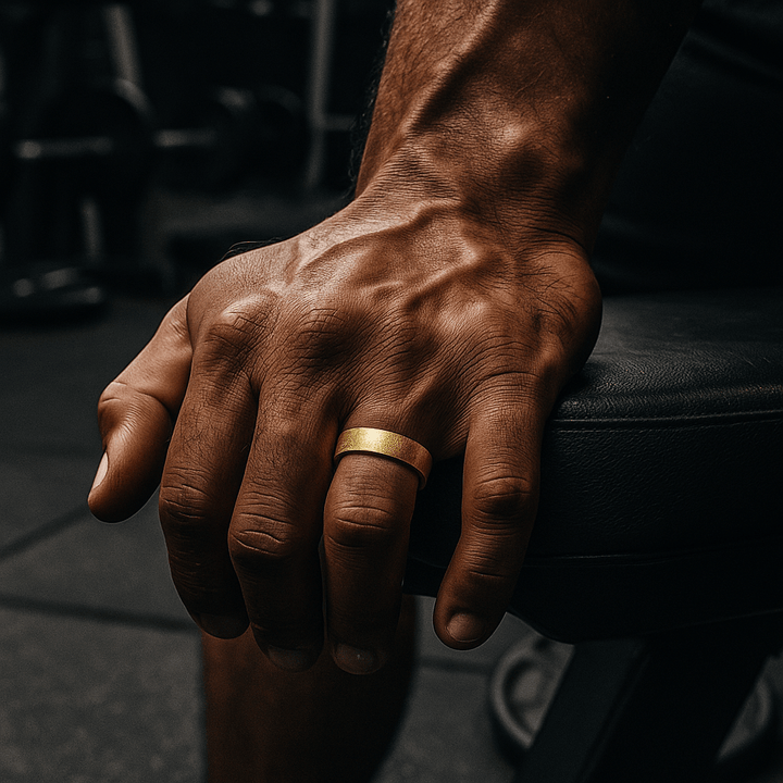 Gold titanium ring with meteorite pattern, domed design, and 8mm width on hand - Aydins Jewelry.