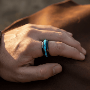 NETARTS — Lifestyle photo on hand — men's tungsten wedding ring.