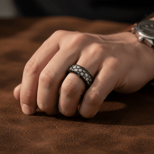 NIKNAM — Lifestyle photo on hand — men's tungsten wedding ring.