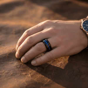 NORWAY — Lifestyle photo on hand — men's tungsten wedding ring.