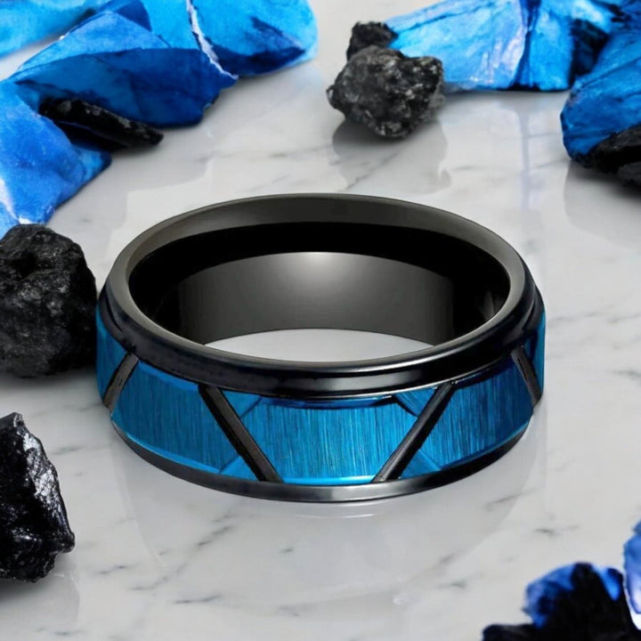 Close-up of the blue and black brushed trapezoid accents on the OBSCURA tungsten ring.