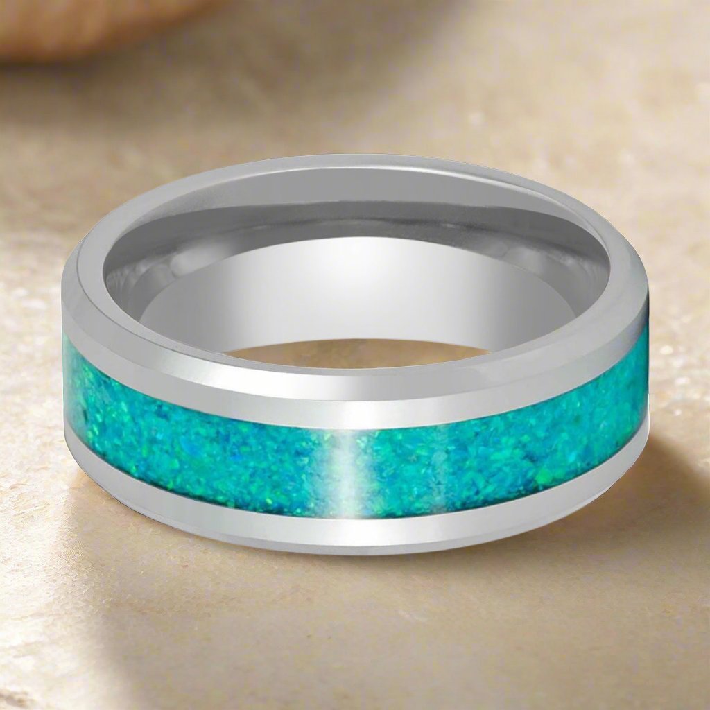 Close-up of the OCEARA tungsten ring with a shimmering kiwi green opal inlay