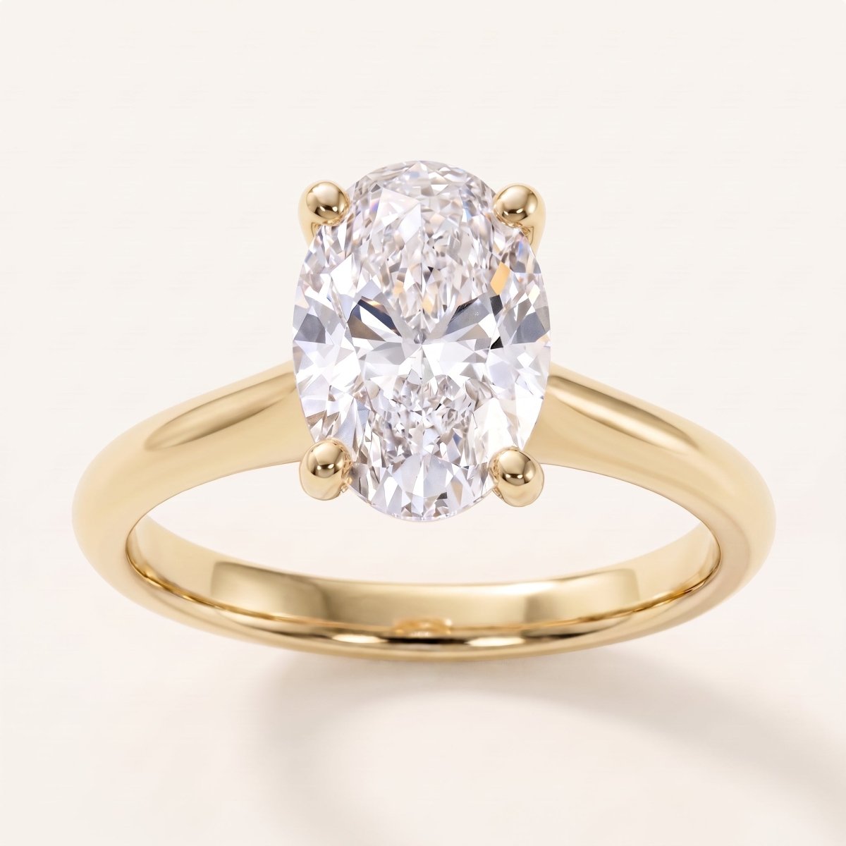 Oval lab-grown diamond solitaire engagement ring, Yellow Gold, face-on detail macro