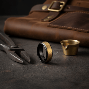 OZAK — Editorial masculine still life — men's tungsten wedding ring.