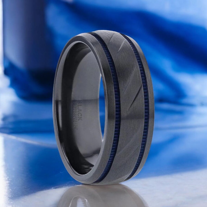 Black titanium ring with blue milgrain grooves and diagonal carved pattern, 8mm width - Aydins Jewelry.