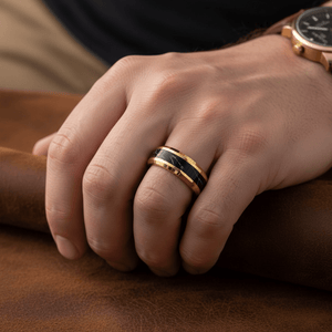 PAVO — Lifestyle photo on hand — men's tungsten wedding ring.