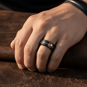 PEAPACK — Lifestyle photo on hand — men's tungsten wedding ring.