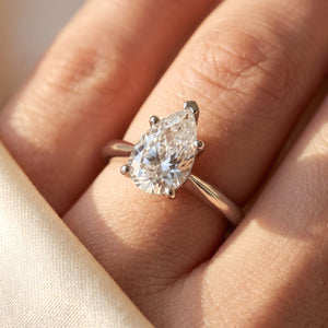 Pear lab-grown diamond solitaire engagement ring, White Gold, on-finger close-up