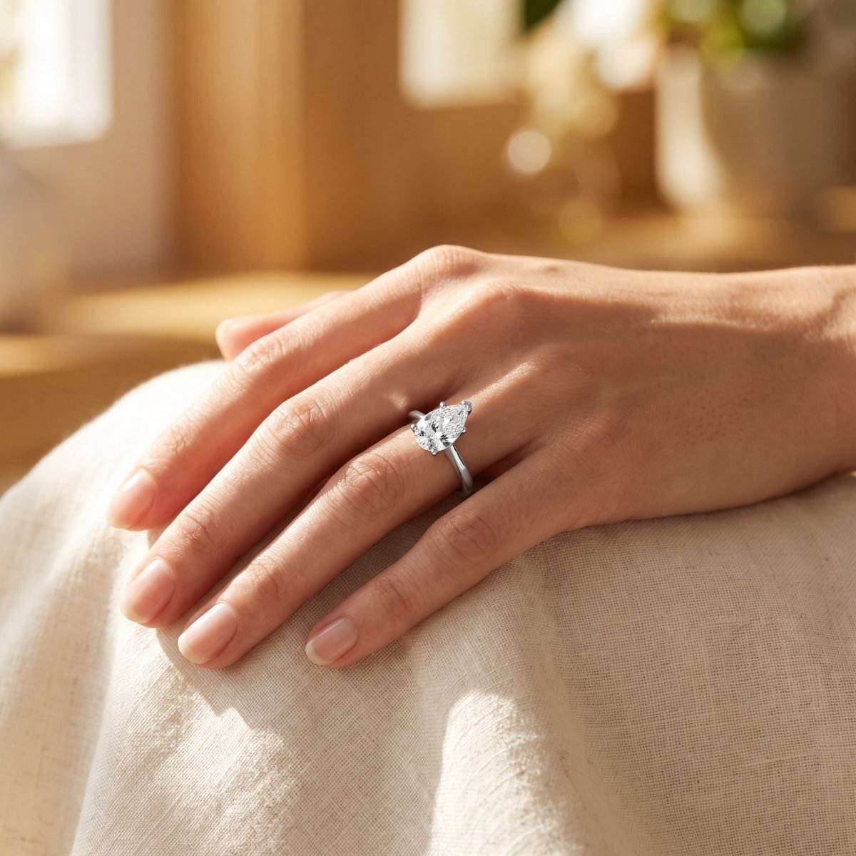 Pear lab-grown diamond solitaire engagement ring, 925 Sterling Silver, lifestyle photograph