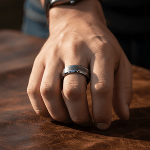 PRECISION — Lifestyle photo on hand — men's tungsten wedding ring.