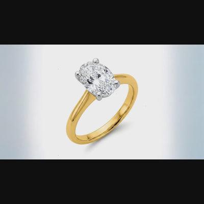 360 degree ping-pong spin video of 2 carat oval lab grown diamond engagement ring in 14K two-tone gold, 16 seconds seamless loop