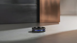Aydins MIRAGE | Black Tungsten Ring, Alexandrite and Goldstone Inlay, Flat cinematic showcase video, concrete industrial aesthetic, seamless loop