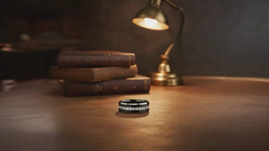 Aydins NEMESIS | Black Tungsten CZ Eternity Wedding Ring — 8mm cinematic showcase video, leather library aesthetic, seamless loop