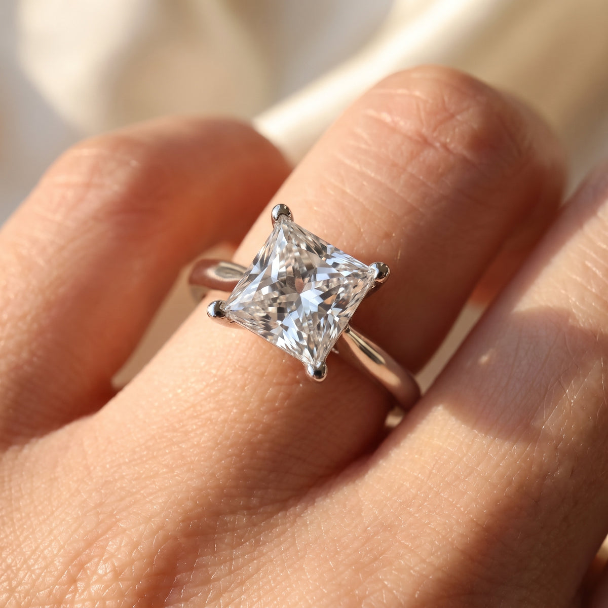 Princess lab-grown diamond solitaire engagement ring, 925 Sterling Silver, on-finger close-up