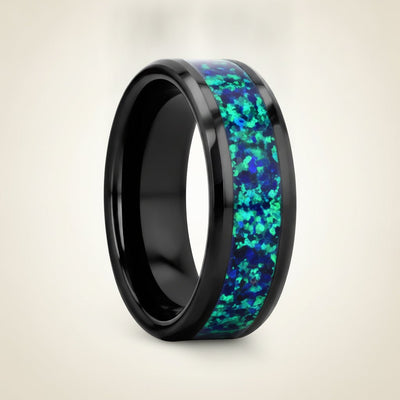 PULSAR black ceramic wedding band with emerald green and sapphire blue color opal inlay running around the band and polished beveled edges, studio hero shot