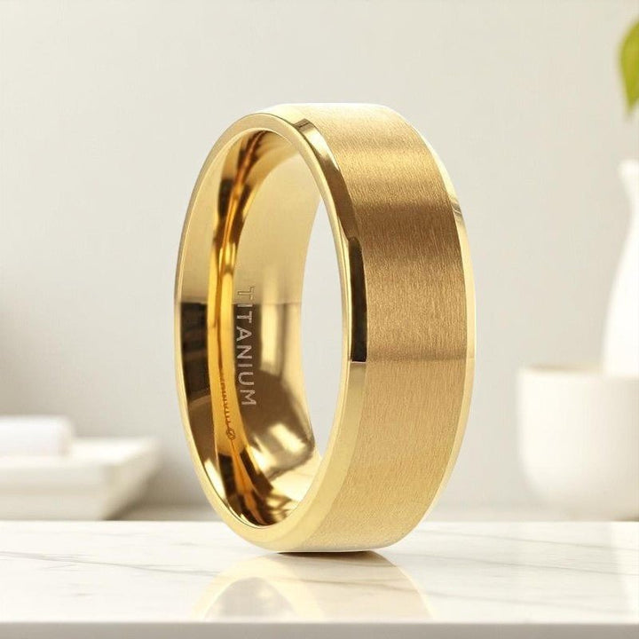 Side view of RADIATE titanium ring with gold brushed center