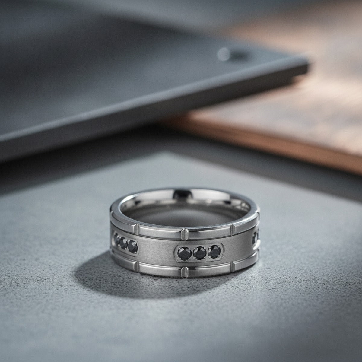 Aydins COURAGEOUS | Silver Titanium Ring, Black Diamonds, Flat lifestyle scene, concrete industrial
