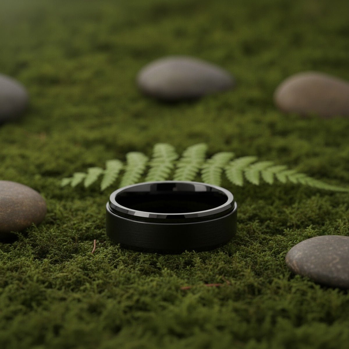 Aydins REVOLVE | Black Tungsten Fidget Spinner Wedding Ring 8mm lifestyle scene, moss forest