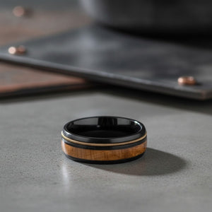 Aydins RIFFSON | Tungsten Whiskey Barrel Wood Inlay Ring 8mm lifestyle scene, concrete industrial