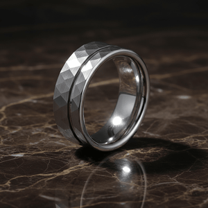 ROCCO — Luxury 3/4 angle on dark marble — men's tungsten wedding ring.
