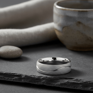 ROUGHZEN — Editorial masculine still life — men's tungsten wedding ring.