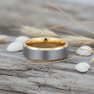 Aydins SAINT | Gold Ring, Brushed, Silver Tungsten Ring, Gold Beveled Edges lifestyle scene, driftwood shells