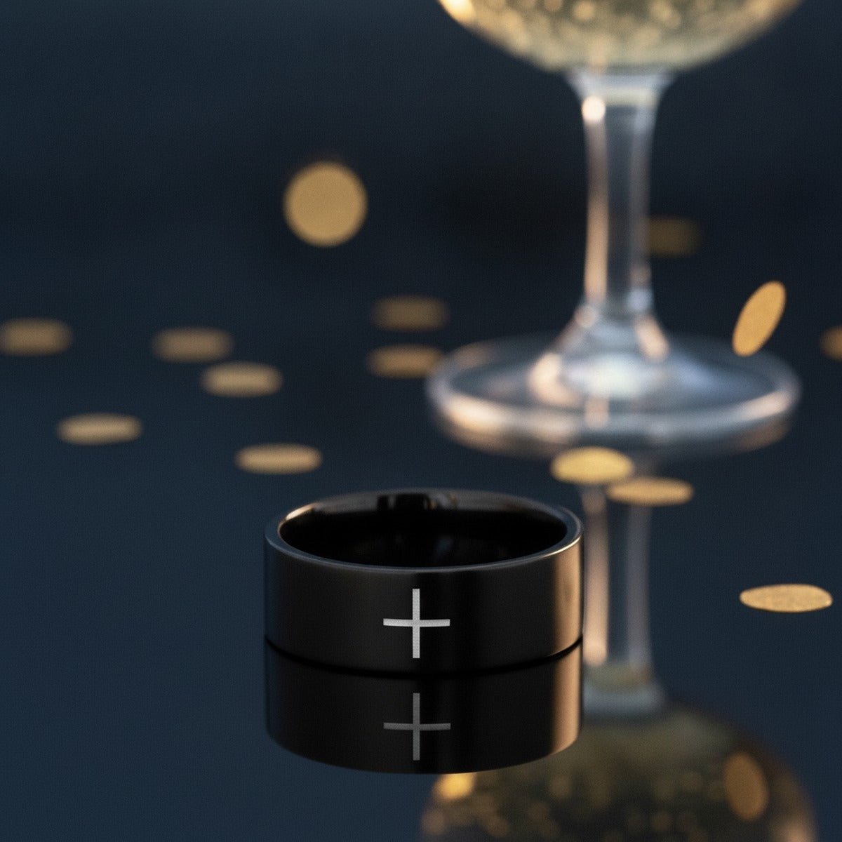 Aydins SANCTUS | Black Tungsten Minimalist Cross Wedding Band, Flat lifestyle scene, new year crystal