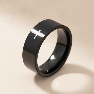 SANCTUS black tungsten wedding band with minimalist cross engraving, studio hero shot