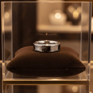 SCORPIO — Premium boutique display on velvet — men's tungsten wedding ring.