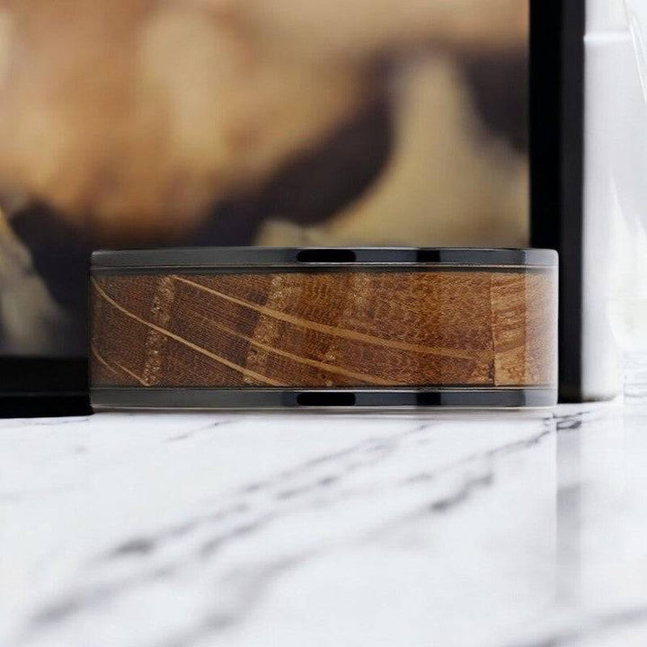 Side profile of SCOTCH ring showing flat polished edges and whiskey barrel wood.