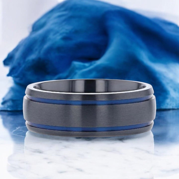 Stylish and bold black titanium wedding band with two blue grooves and a domed design - Aydins Jewelry.