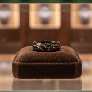 SLICK — Premium boutique display on velvet — men's tungsten wedding ring.
