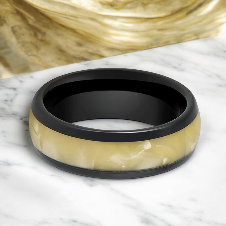 Close-up of SOLSTICE Tungsten Wedding Band with luminous mother-of-pearl details.