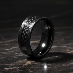 SPEEDSTER — Luxury 3/4 angle on dark marble — men's tungsten wedding ring.