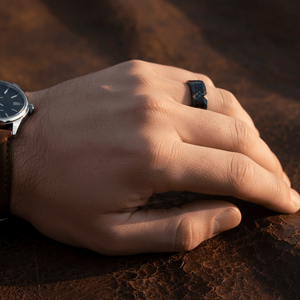 SPEEDSTER — Lifestyle photo on hand — men's tungsten wedding ring.