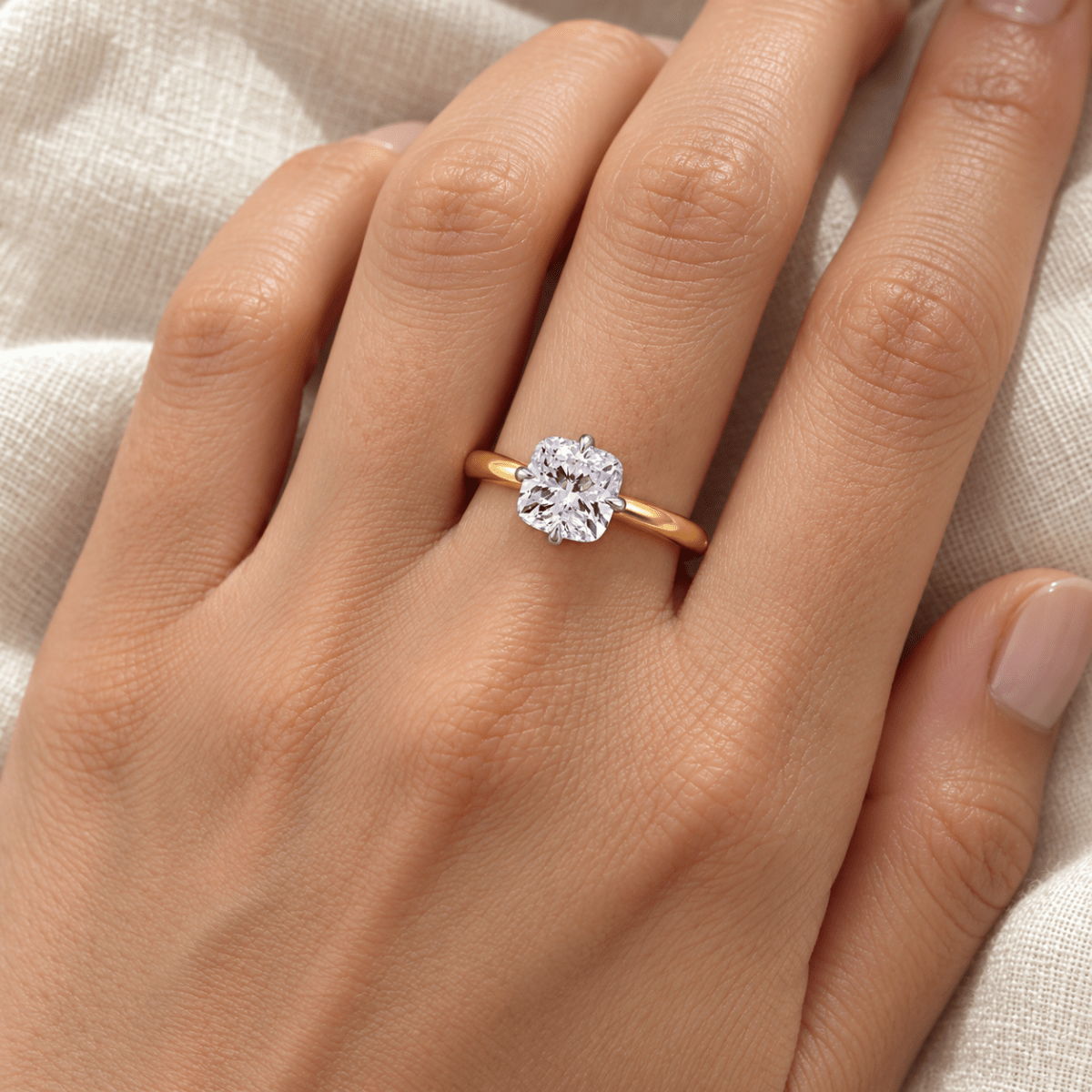 SYLVIE cushion lab-grown diamond ring in 14K two-tone gold, worn on hand, approx. 1 ct center