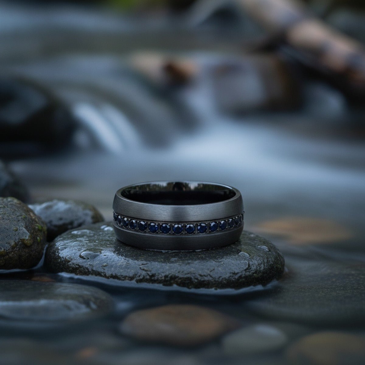 Aydins TALON | Black Titanium Ring, Black Sapphires Inlay, Domed lifestyle scene, river stones