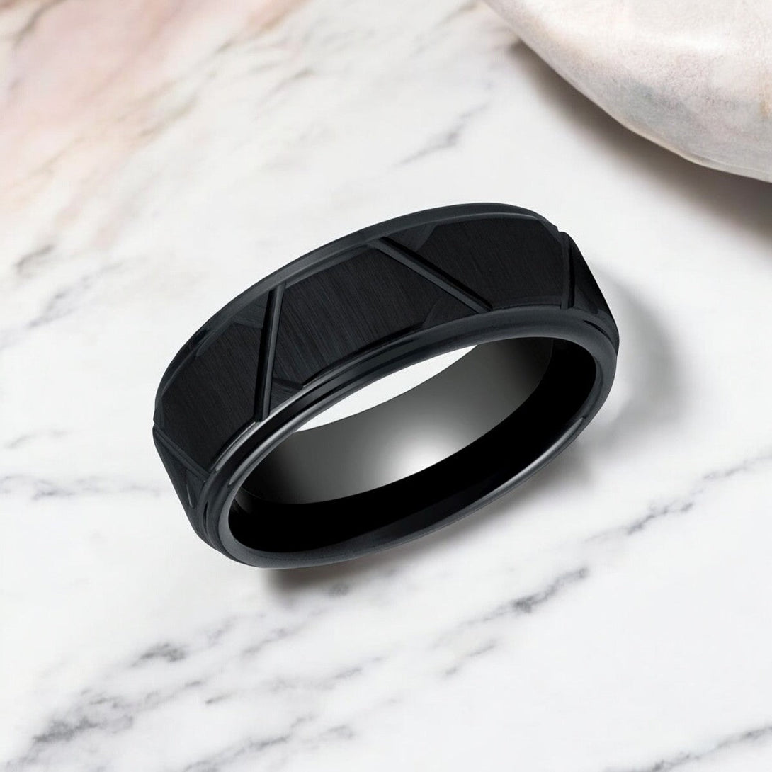 Close-up of the stepped edge and unique trapezoid pattern on the TERRANCE ring.