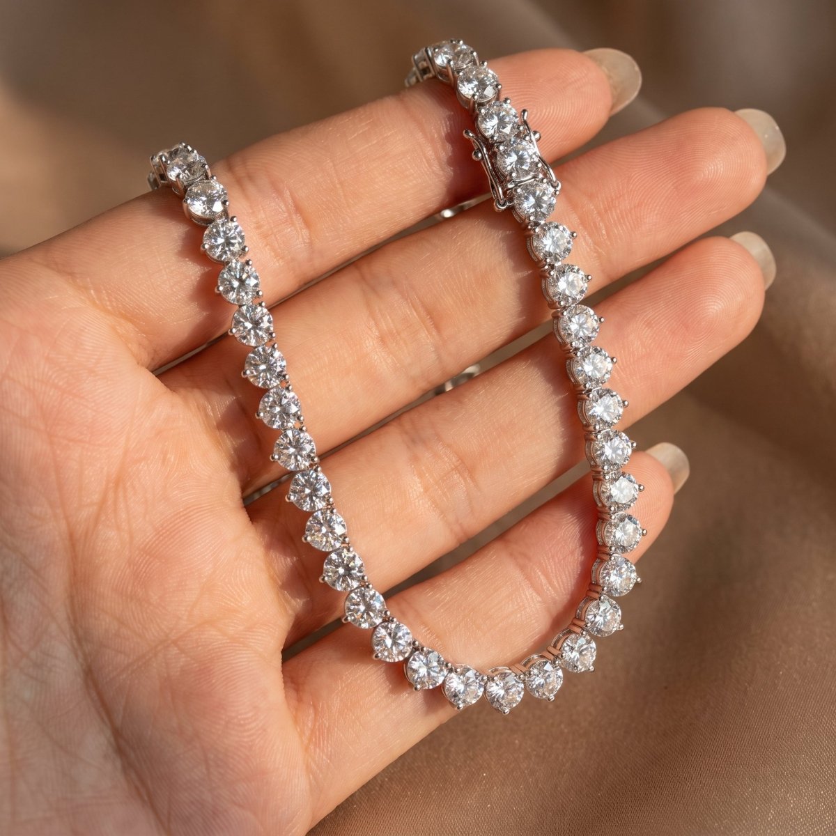 Three Prong Straight Line Necklace 925 silver lab grown diamond necklace held in hand lifestyle close-up photo