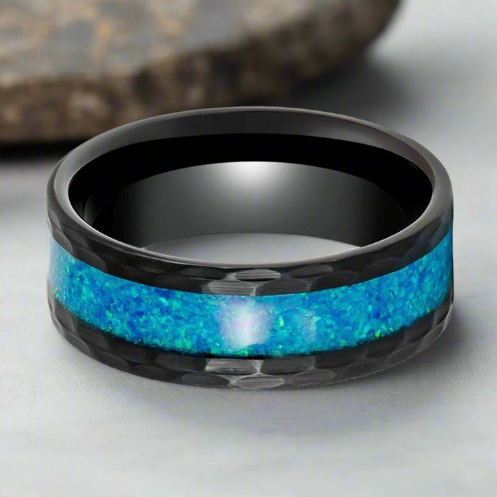 Close-up of TIDAL Ring's Blue Faux Opal Inlay and Hammered Black Tungsten Edges