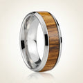 TIGRE silver tungsten wedding band with striped zebra wood inlay running around the band and polished edges, studio hero shot