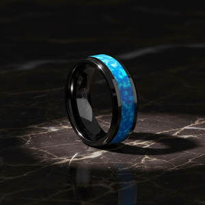 TRANQUIL — Luxury 3/4 angle on dark marble — men's tungsten wedding ring.
